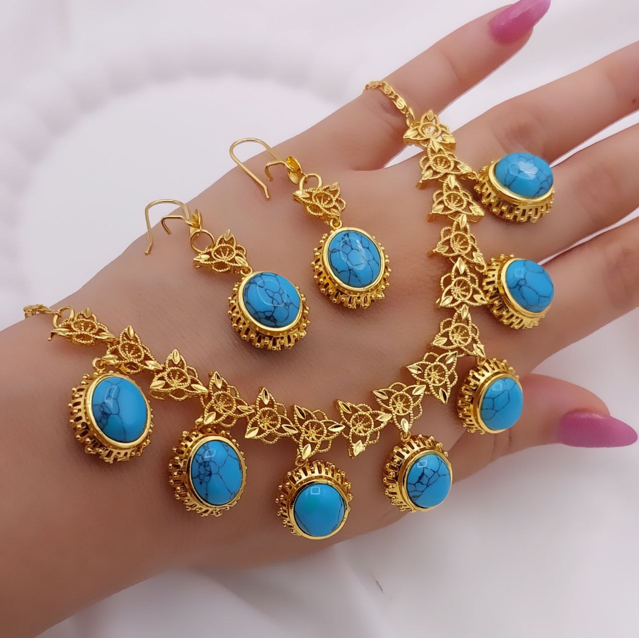 نیم‌ست زنانه فیروزه‌ای طرح طلا